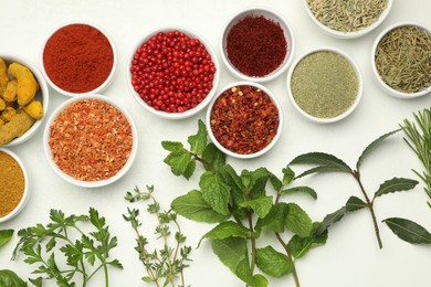 Photo of Different aromatic spices and herbs on white background, flat lay