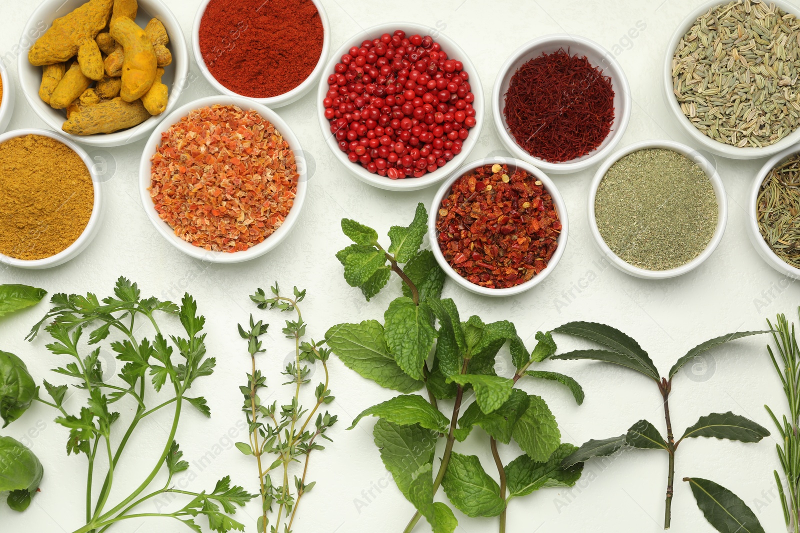 Photo of Different aromatic spices and herbs on white background, flat lay