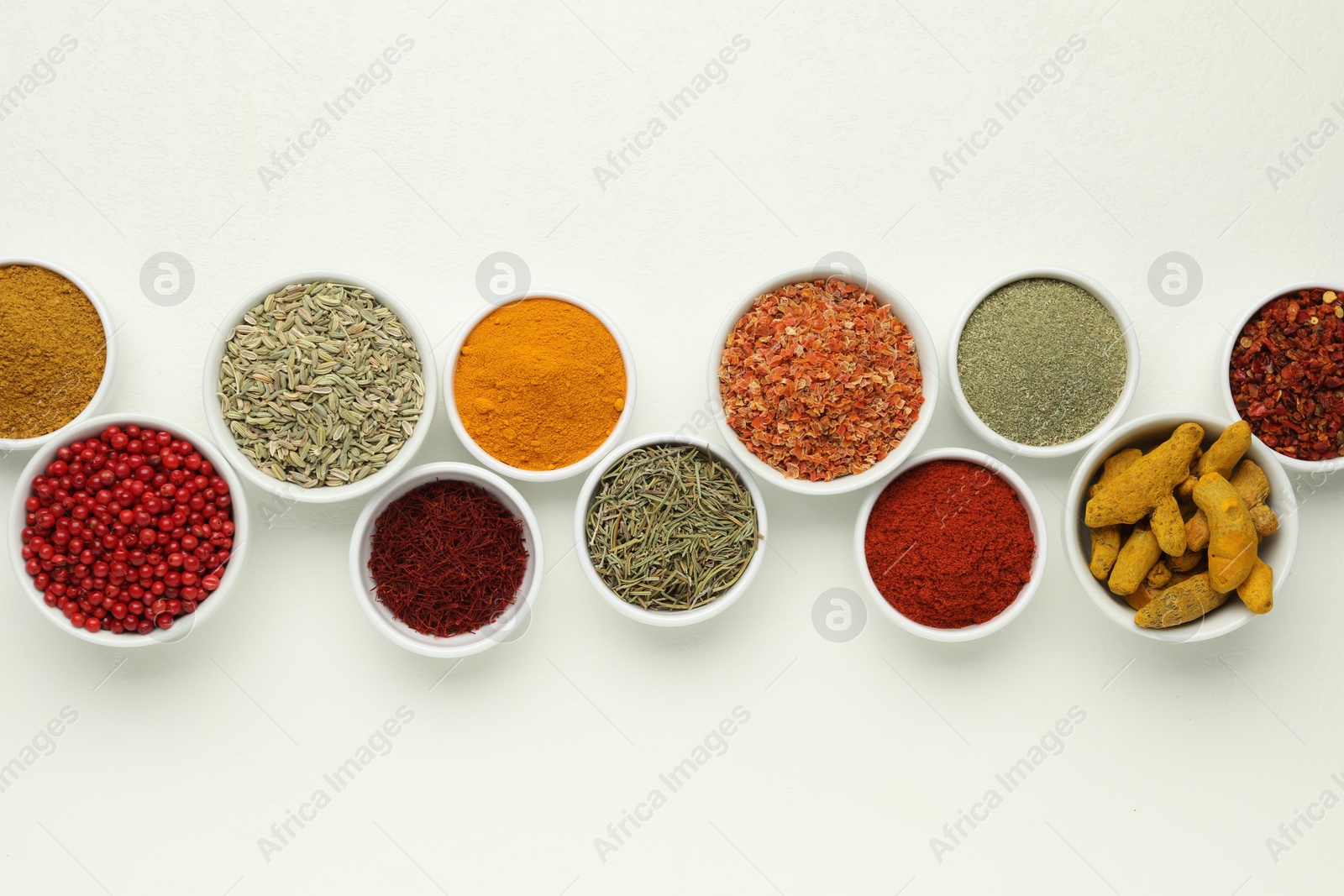 Photo of Different aromatic spices and herbs on white background, flat lay