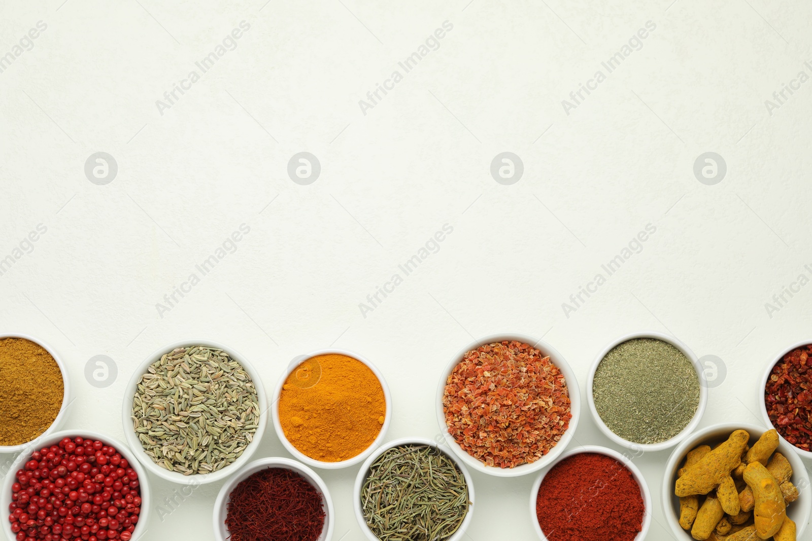 Photo of Different aromatic spices and herbs on white background, flat lay