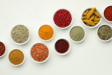 Photo of Different aromatic spices and herbs on white background, flat lay