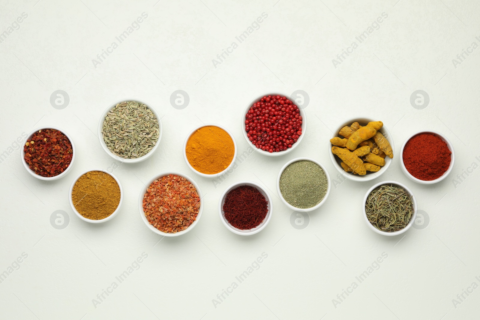 Photo of Different aromatic spices and herbs on white background, flat lay