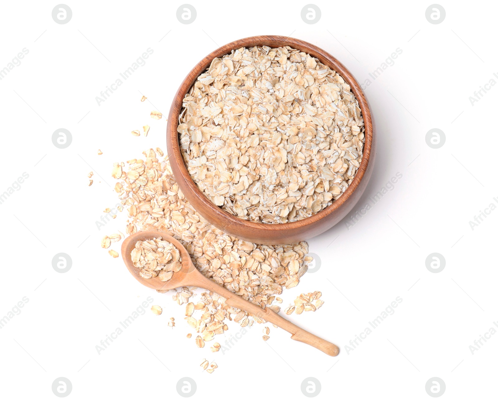 Photo of Oat flakes in bowl and spoon isolated on white, top view