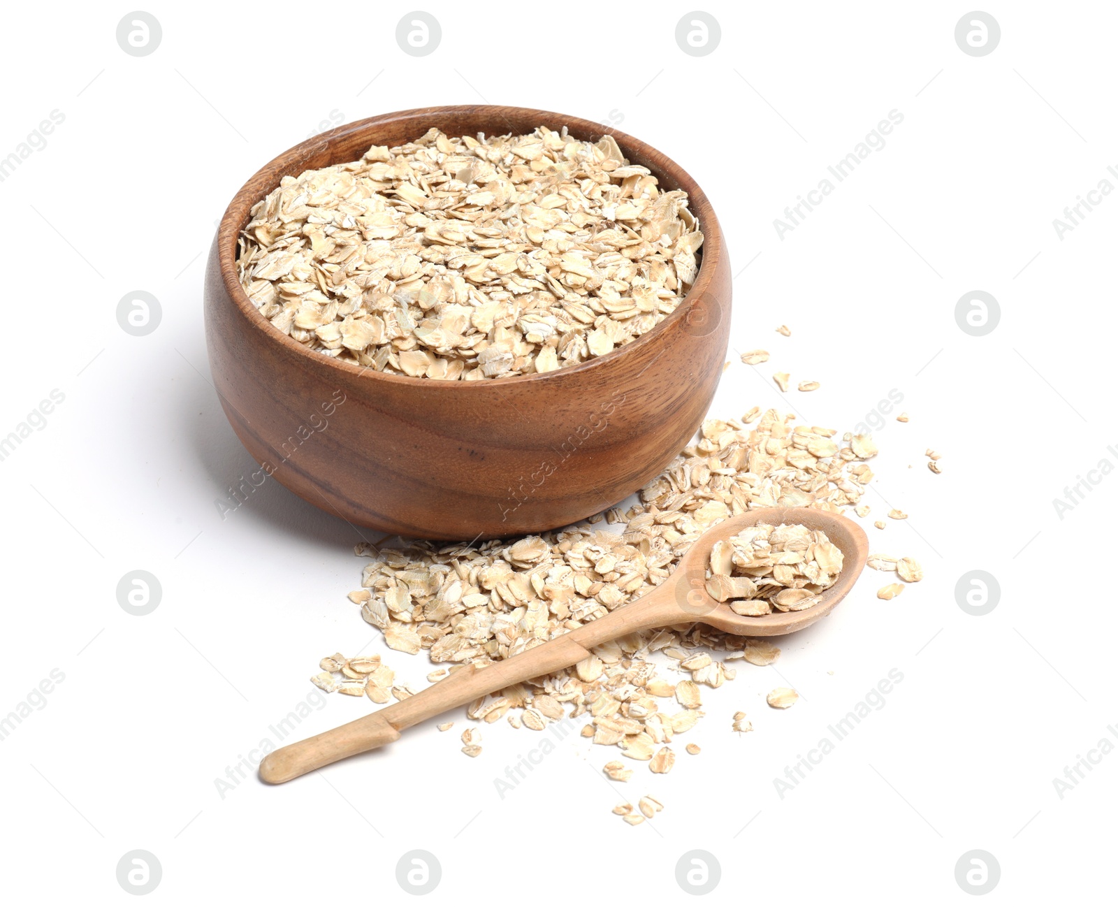 Photo of Oat flakes in bowl and spoon isolated on white