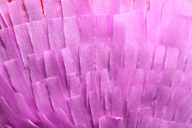 Photo of Pinata. Cut tissue paper as background, closeup