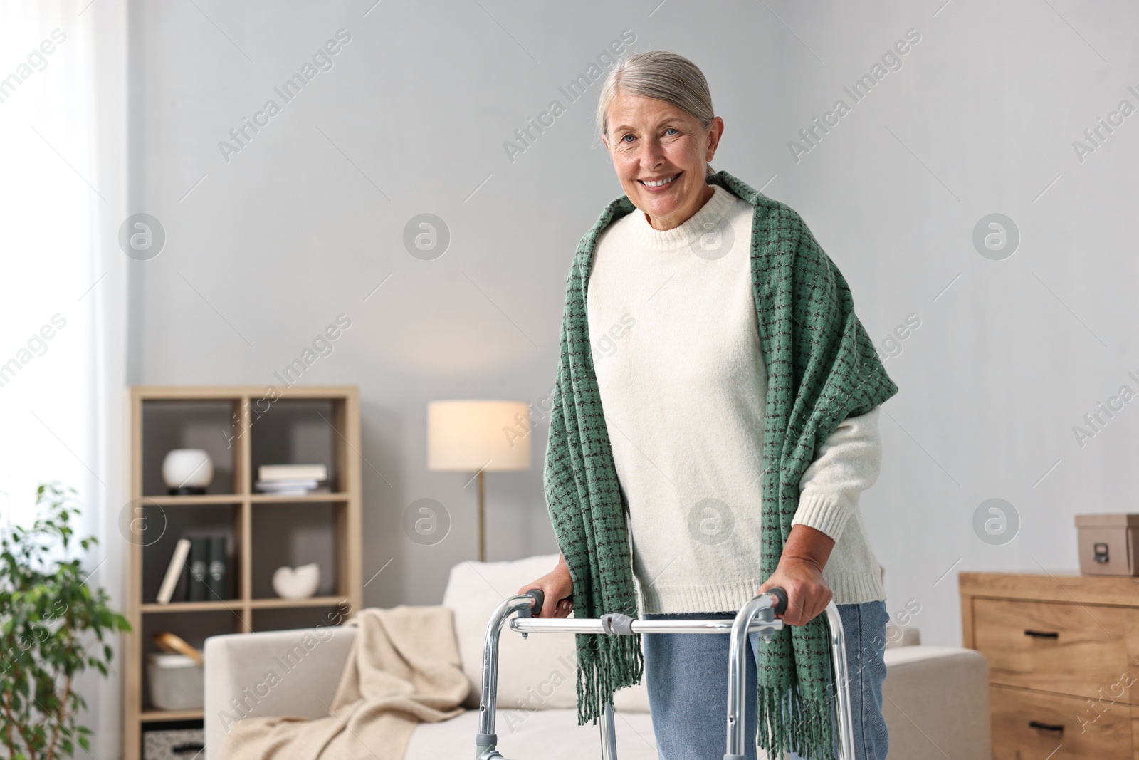 Photo of Senior woman with walking frame at home