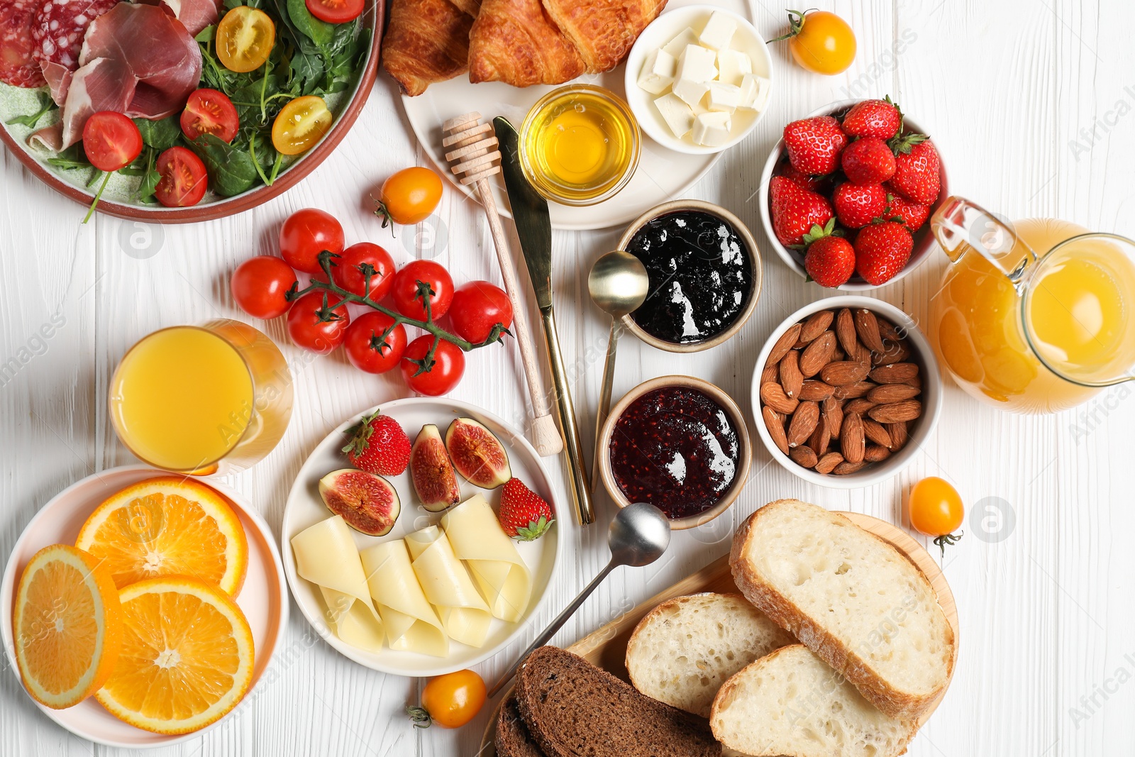 Photo of Different tasty food served for brunch on white wooden table, flat lay