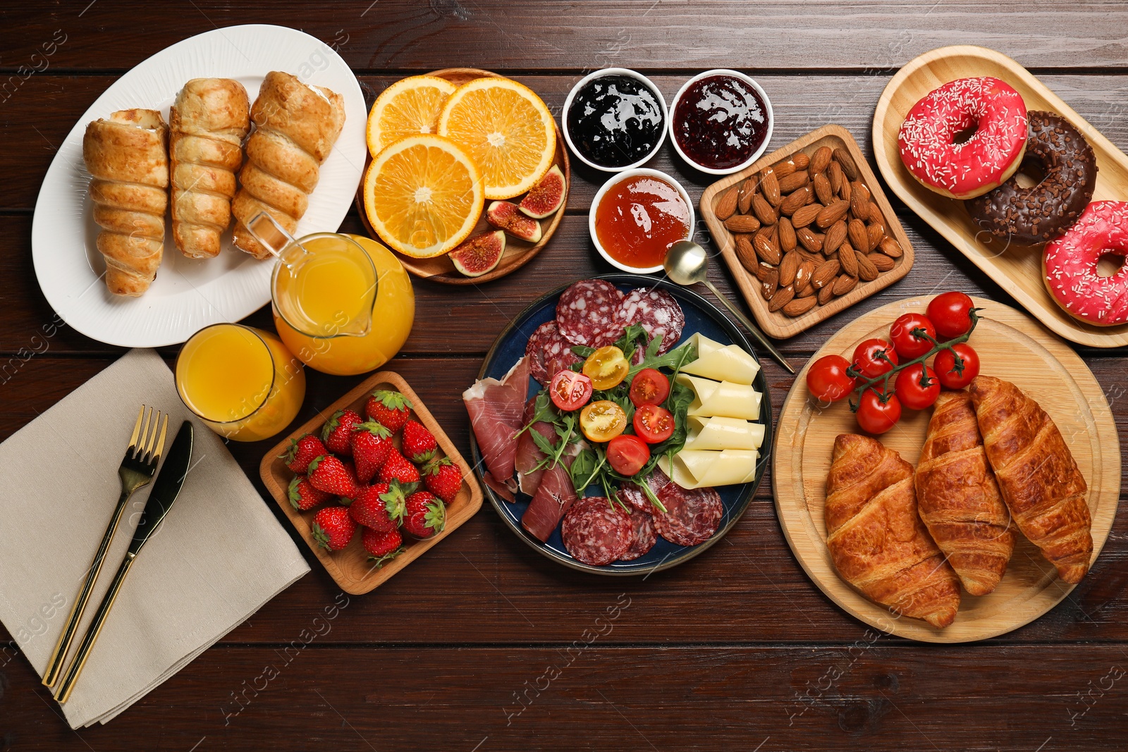 Photo of Different tasty food served for brunch on wooden table, flat lay