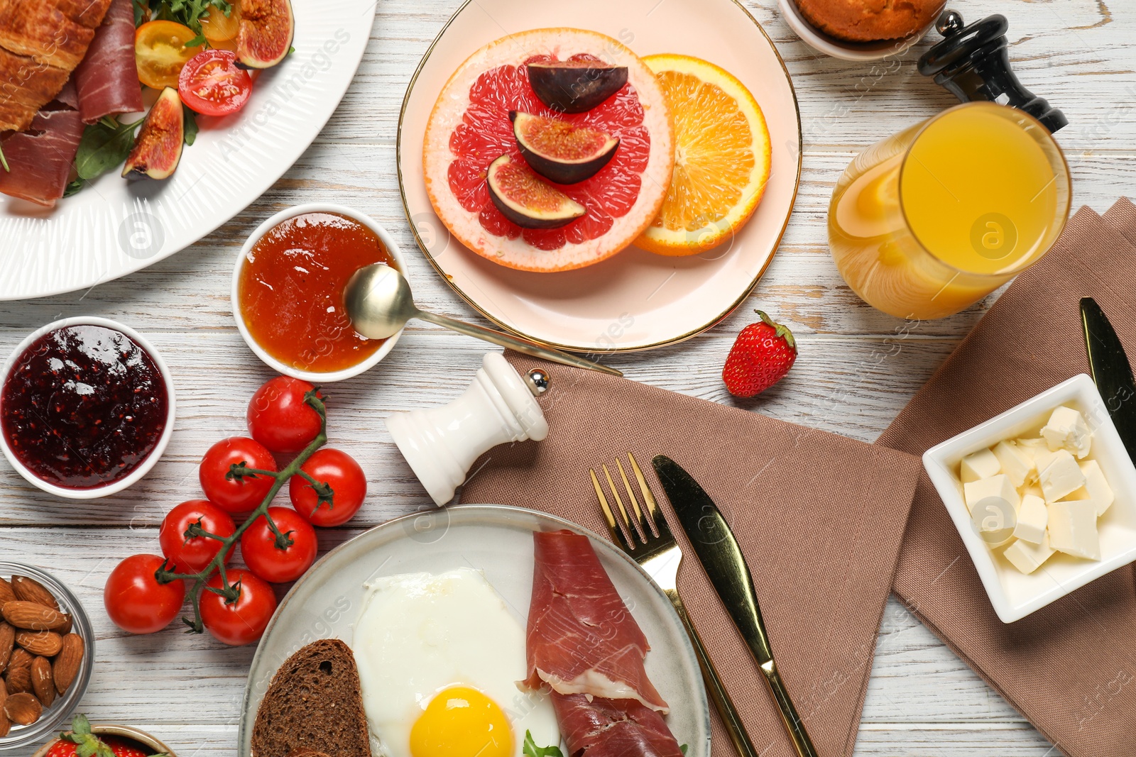 Photo of Different tasty food served for brunch on white wooden table, flat lay