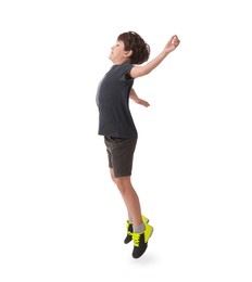 Boy with soccer ball playing football on white background