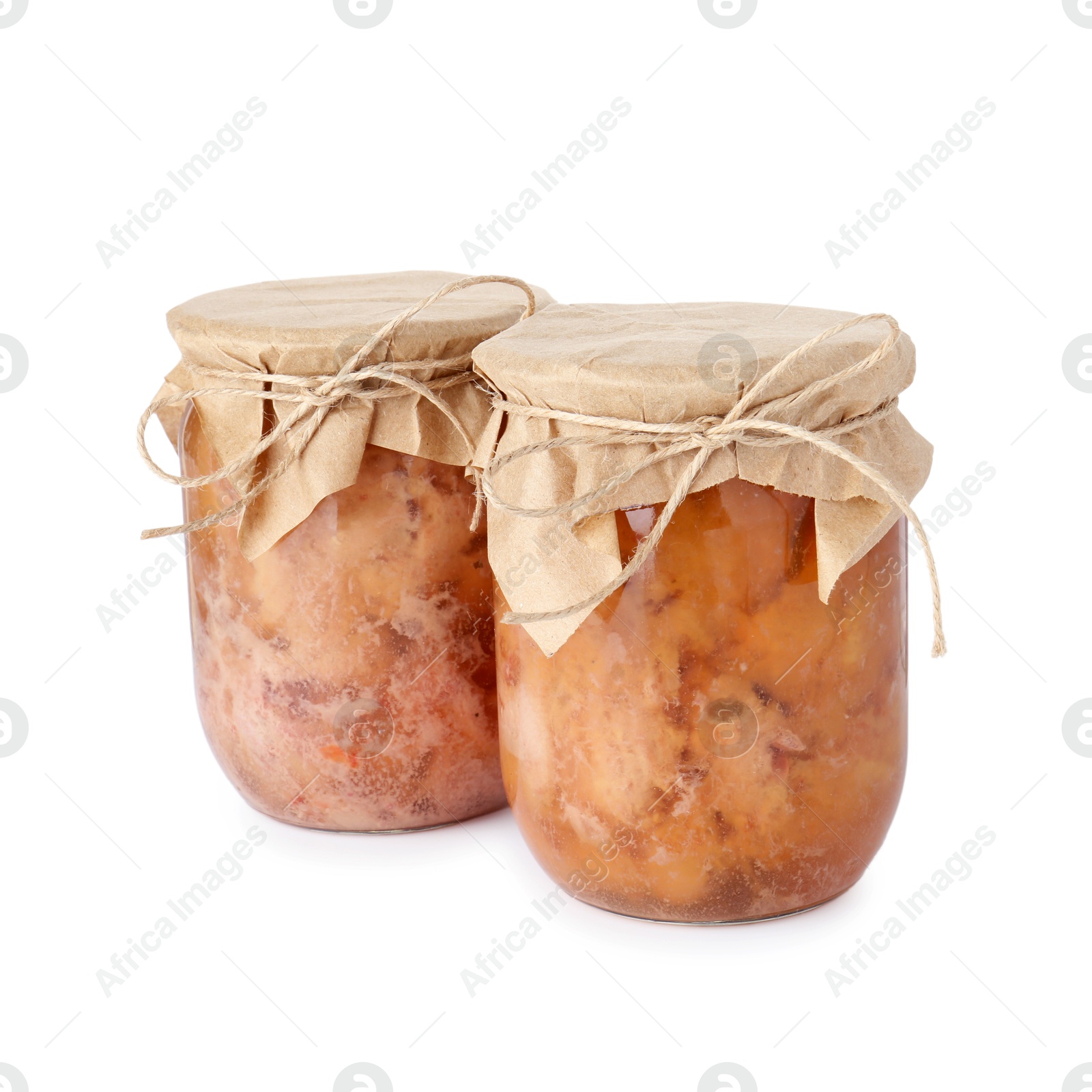 Photo of Canned meat in glass jars isolated on white