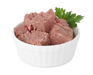 Photo of Canned meat with fresh parsley in bowl isolated on white