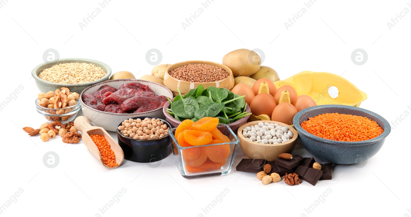 Photo of Different products rich in iron on white background. Anemia diet plan