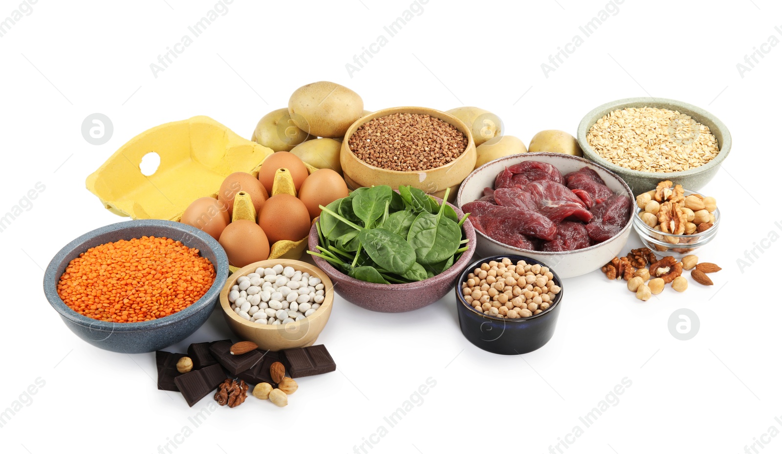 Photo of Different products rich in iron on white background. Anemia diet plan