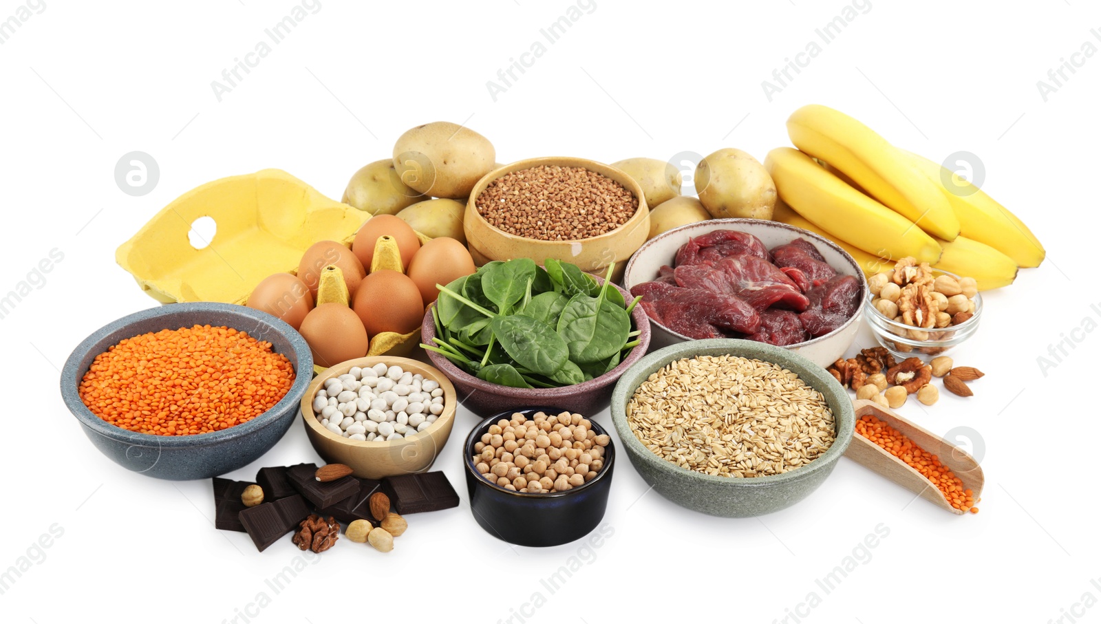 Photo of Different products rich in iron on white background. Anemia diet plan