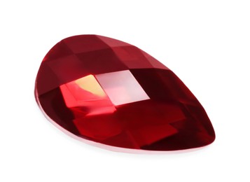 Photo of One red shiny gemstone isolated on white