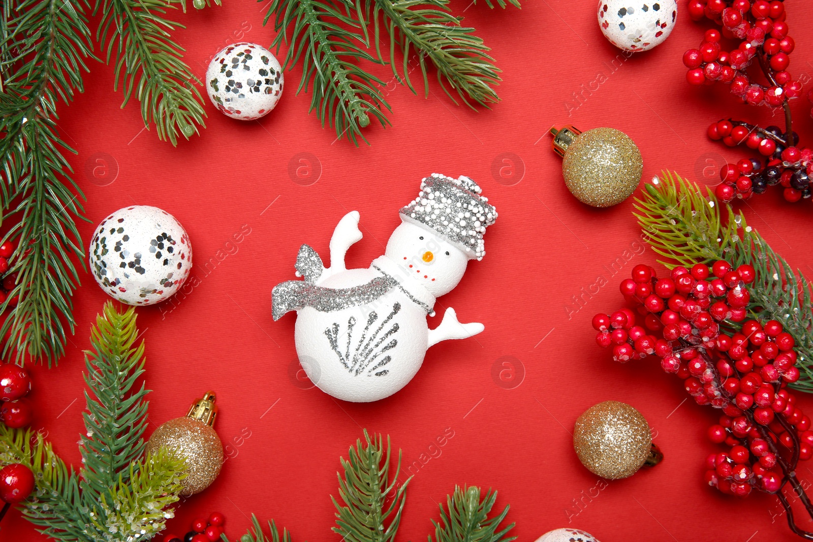 Photo of Flat lay composition with Christmas decor on red background