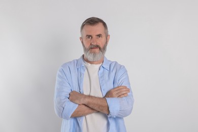 Photo of Portrait of senior man on white background