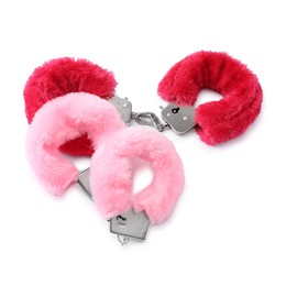 Photo of Pink fluffy handcuffs isolated on white. Sex toy