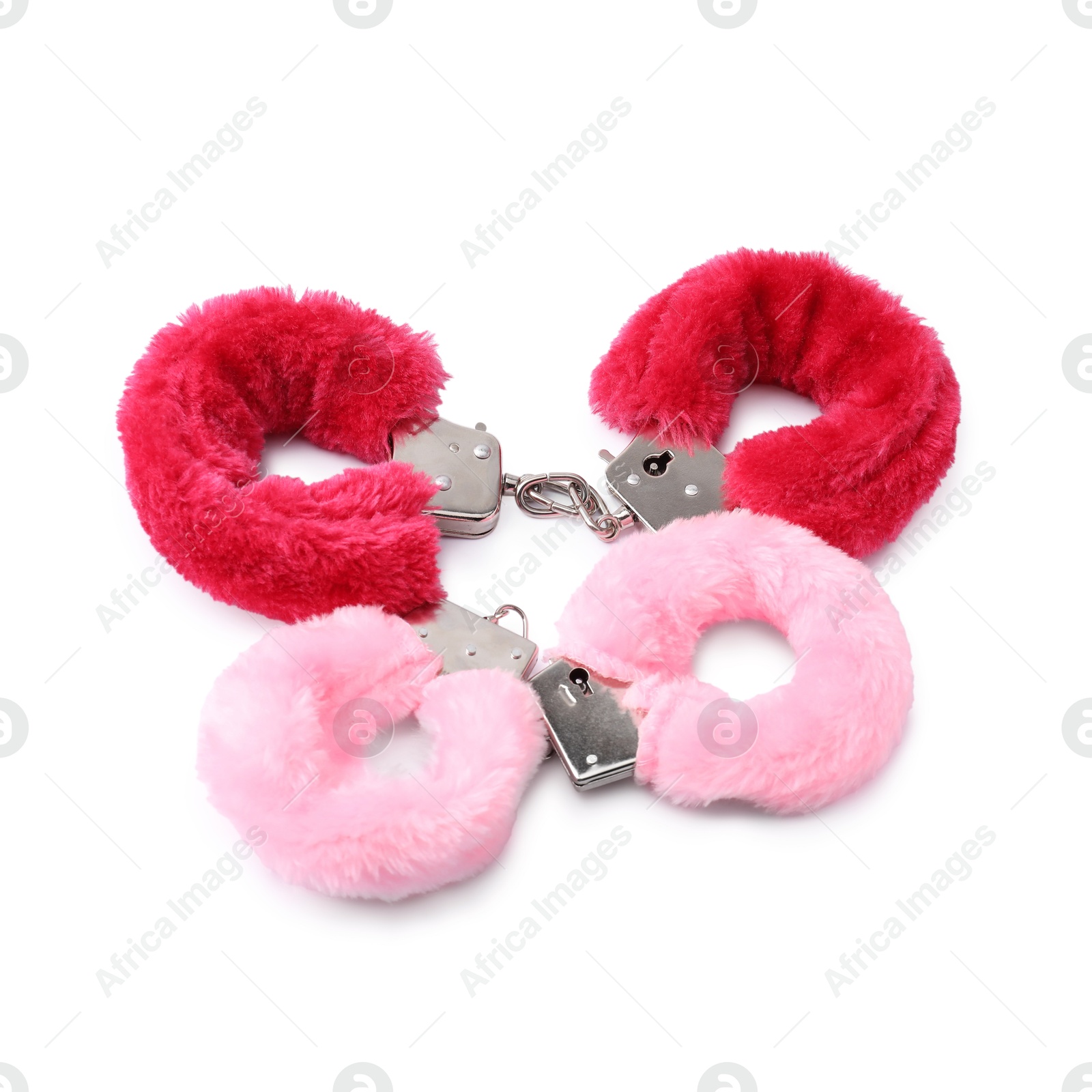 Photo of Pink fluffy handcuffs isolated on white. Sex toy