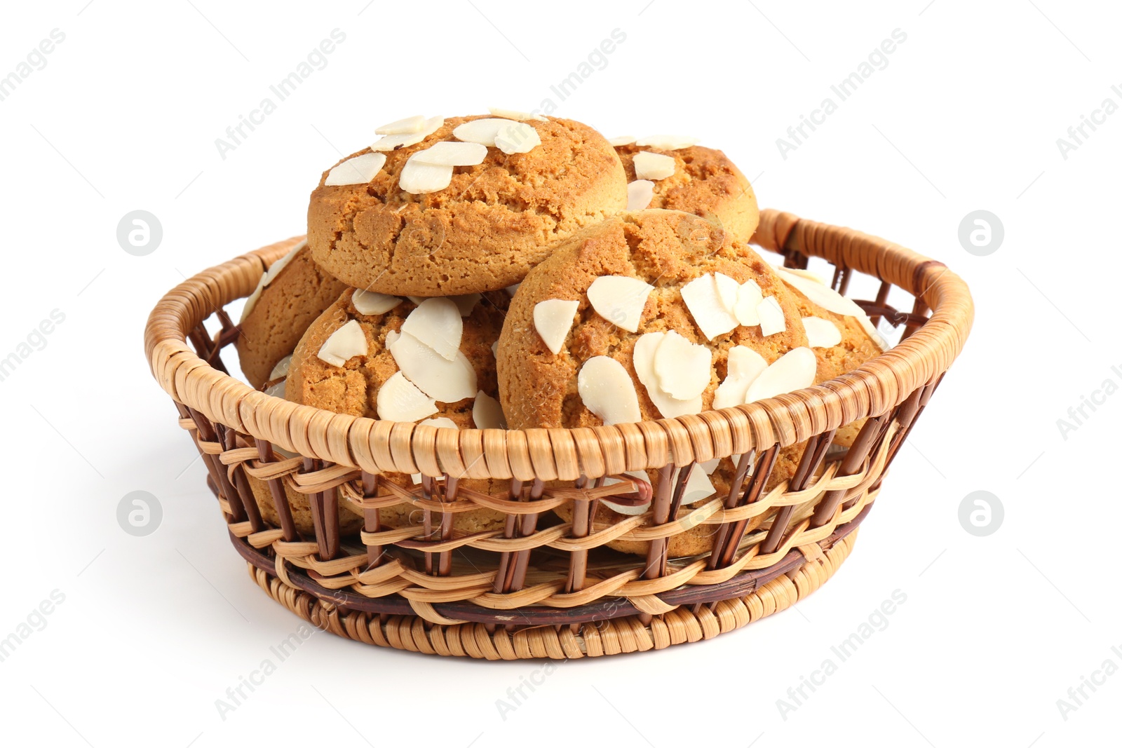 Photo of Tasty cookies with almond flakes in wicker basket isolated on white