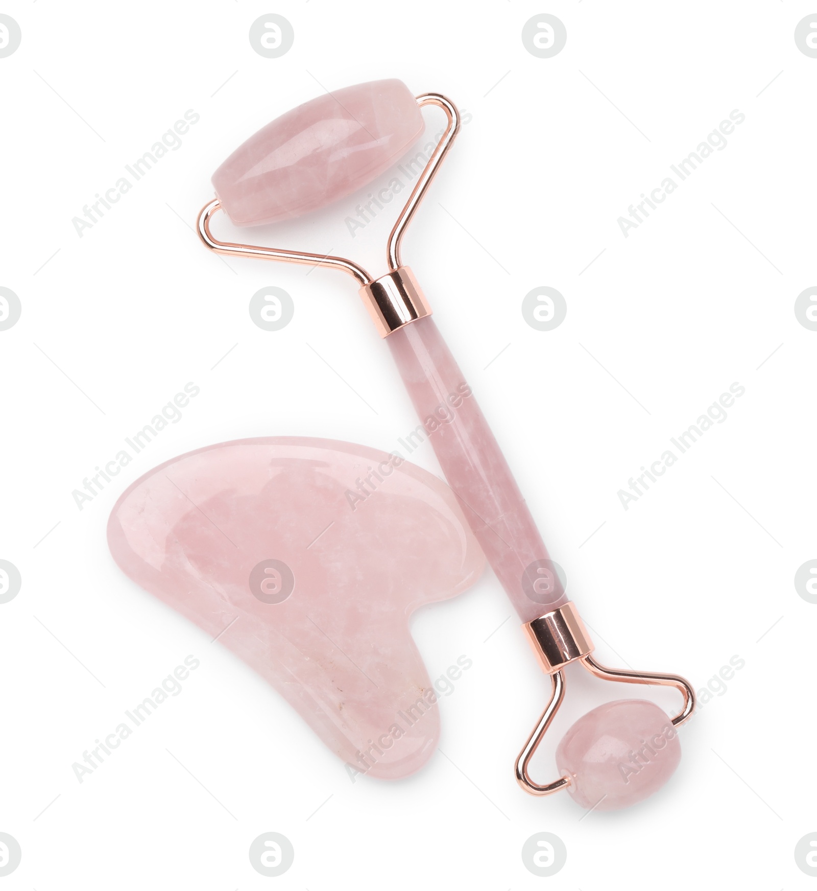 Photo of Face roller and gua sha tool isolated on white, top view