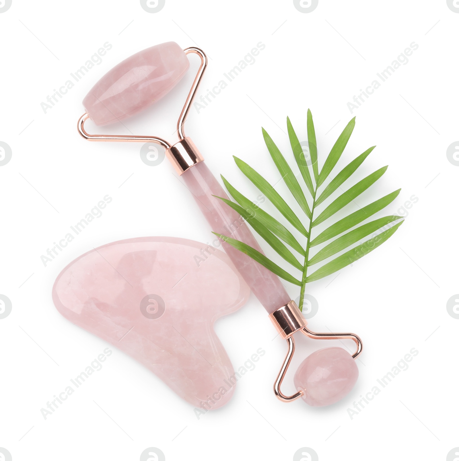 Photo of Face roller and gua sha tool isolated on white, top view