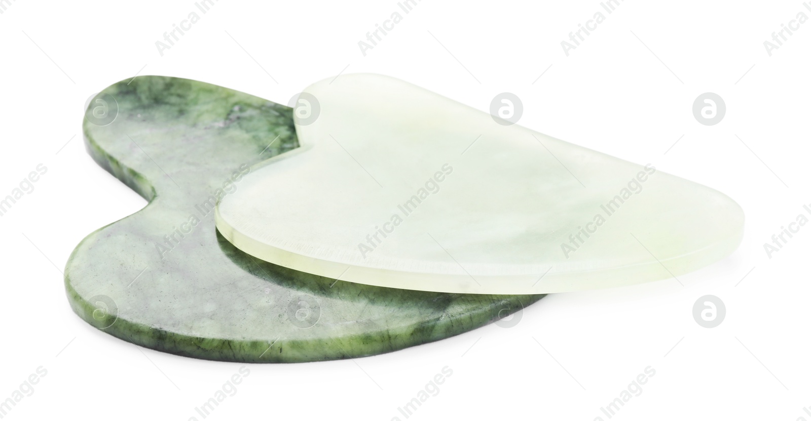 Photo of Different gua sha tools isolated on white