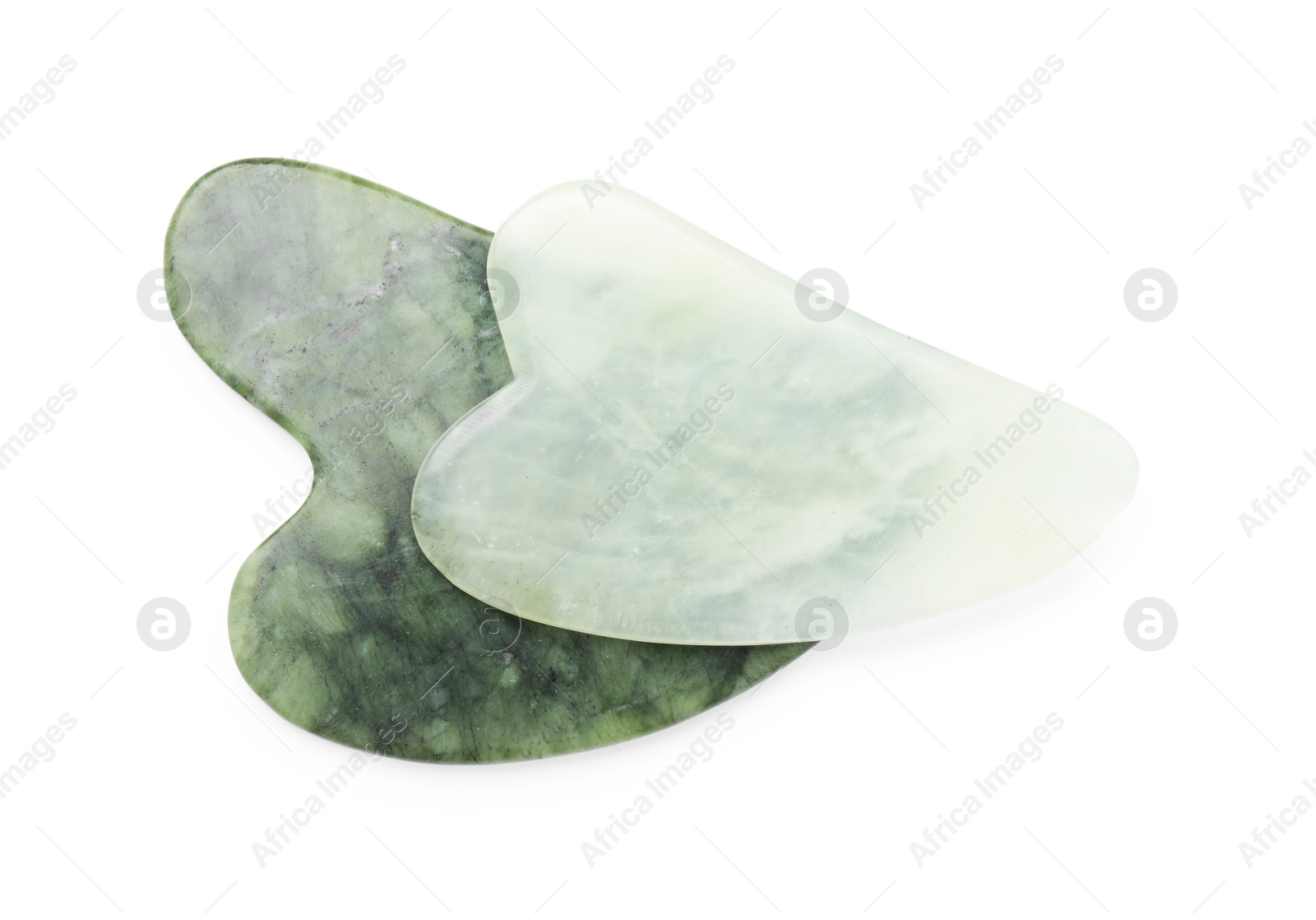 Photo of Different gua sha tools isolated on white, top view