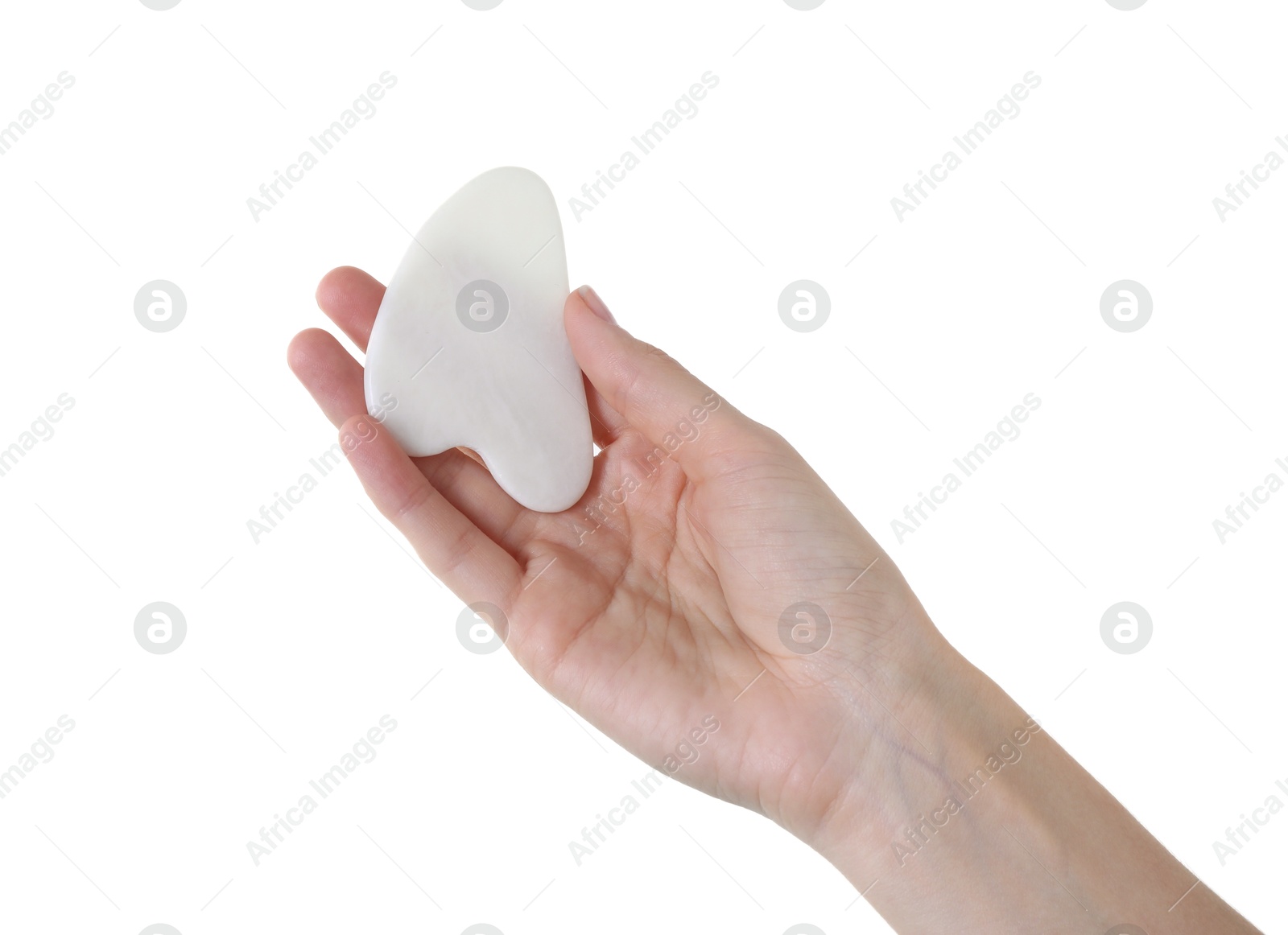 Photo of Woman holding gua sha tool on white background, closeup