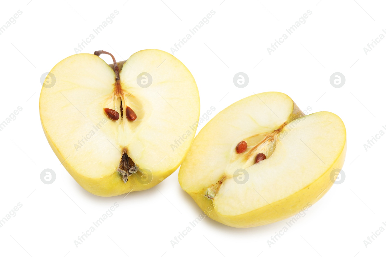 Photo of Halves of ripe yellow apple isolated on white