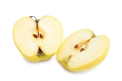 Halves of ripe yellow apple isolated on white