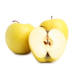 Photo of Whole and cut ripe yellow apples isolated on white