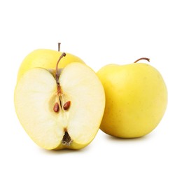 Photo of Whole and cut ripe yellow apples isolated on white