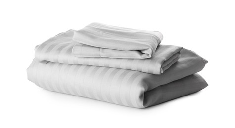 Photo of Stack of clean bed sheets isolated on white