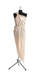 Photo of Draping beige fabric on female mannequin against white background