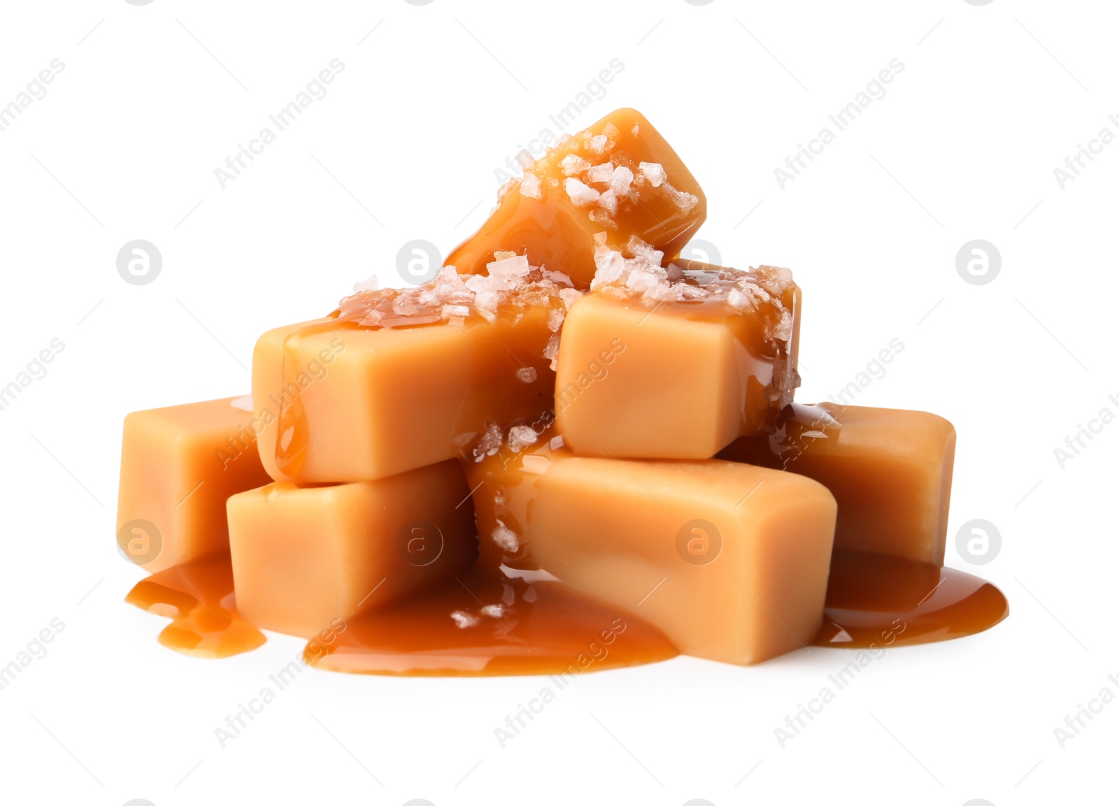 Photo of Tasty candies with salted caramel isolated on white