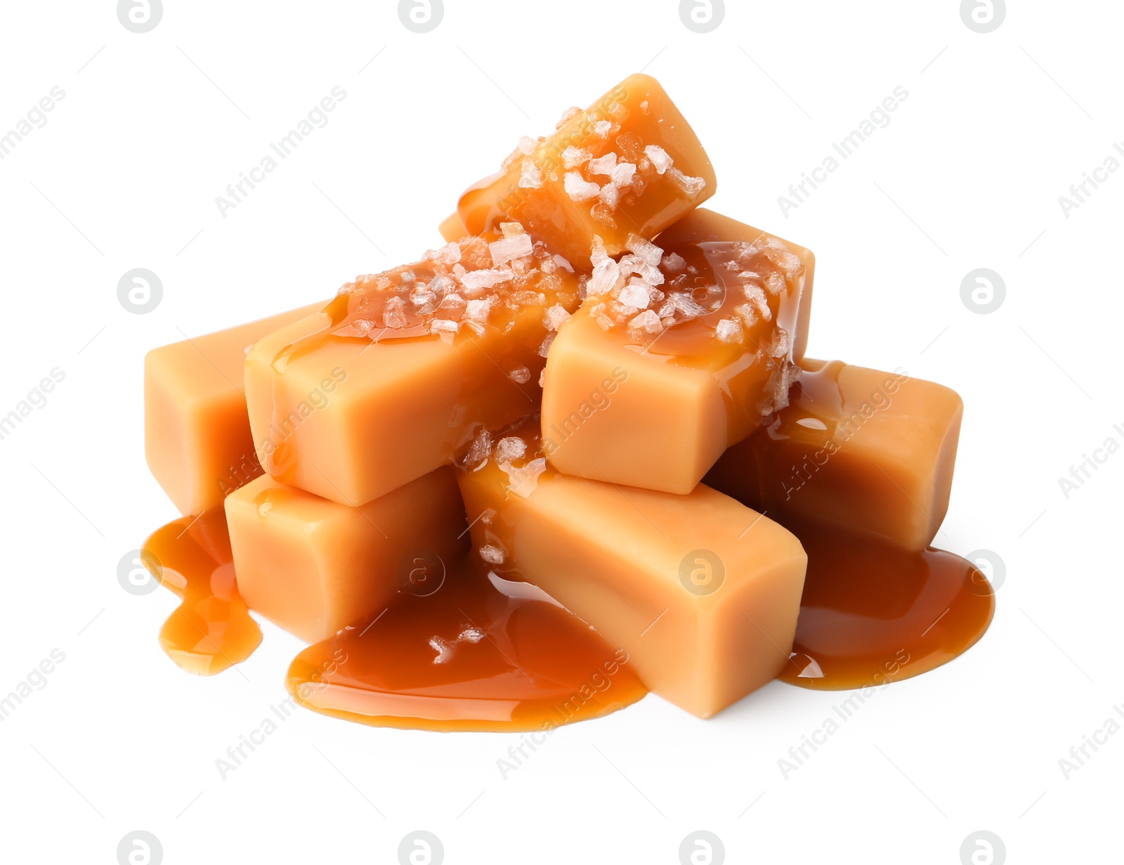 Photo of Tasty candies with salted caramel isolated on white