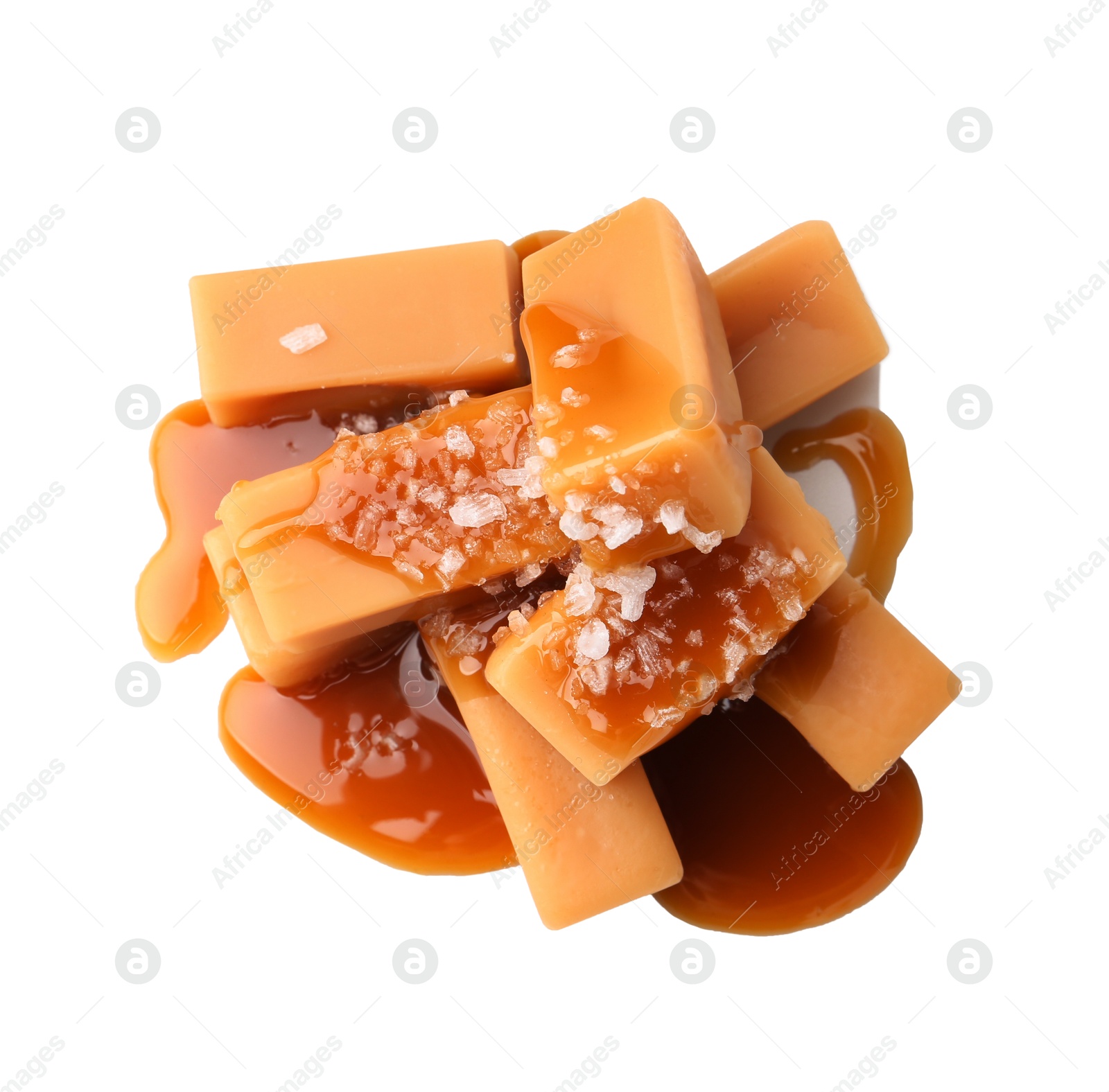 Photo of Tasty candies with salted caramel isolated on white, top view