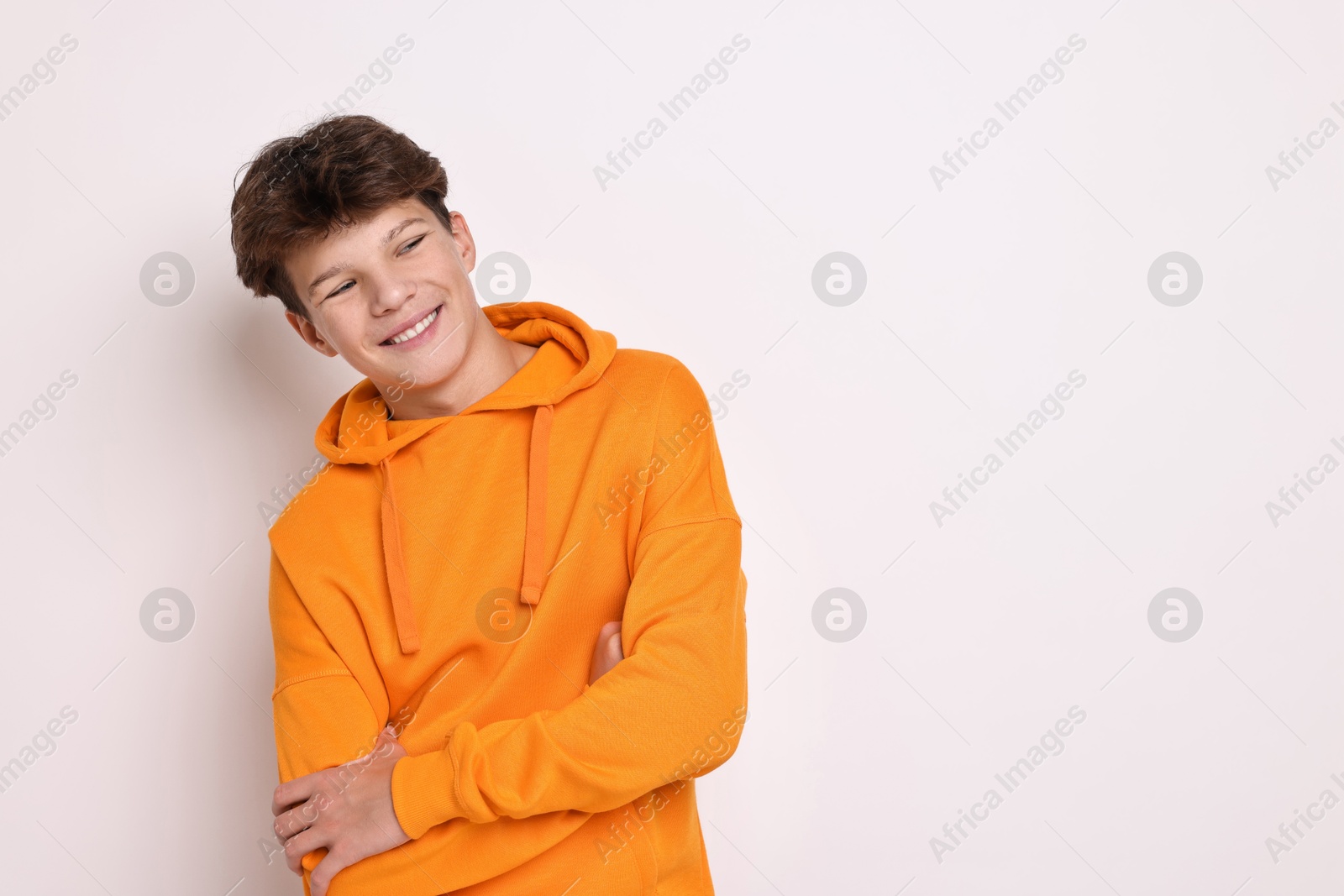 Photo of Portrait of teenage boy on white background, space for text