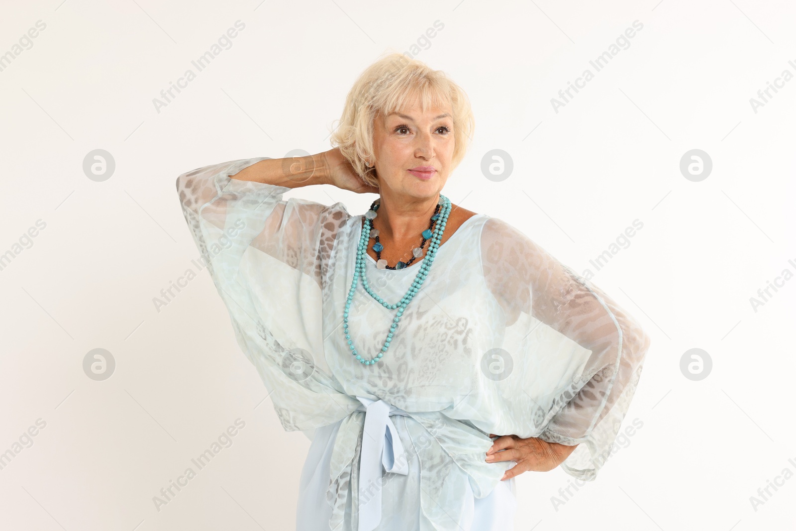 Photo of Portrait of beautiful senior woman on white background