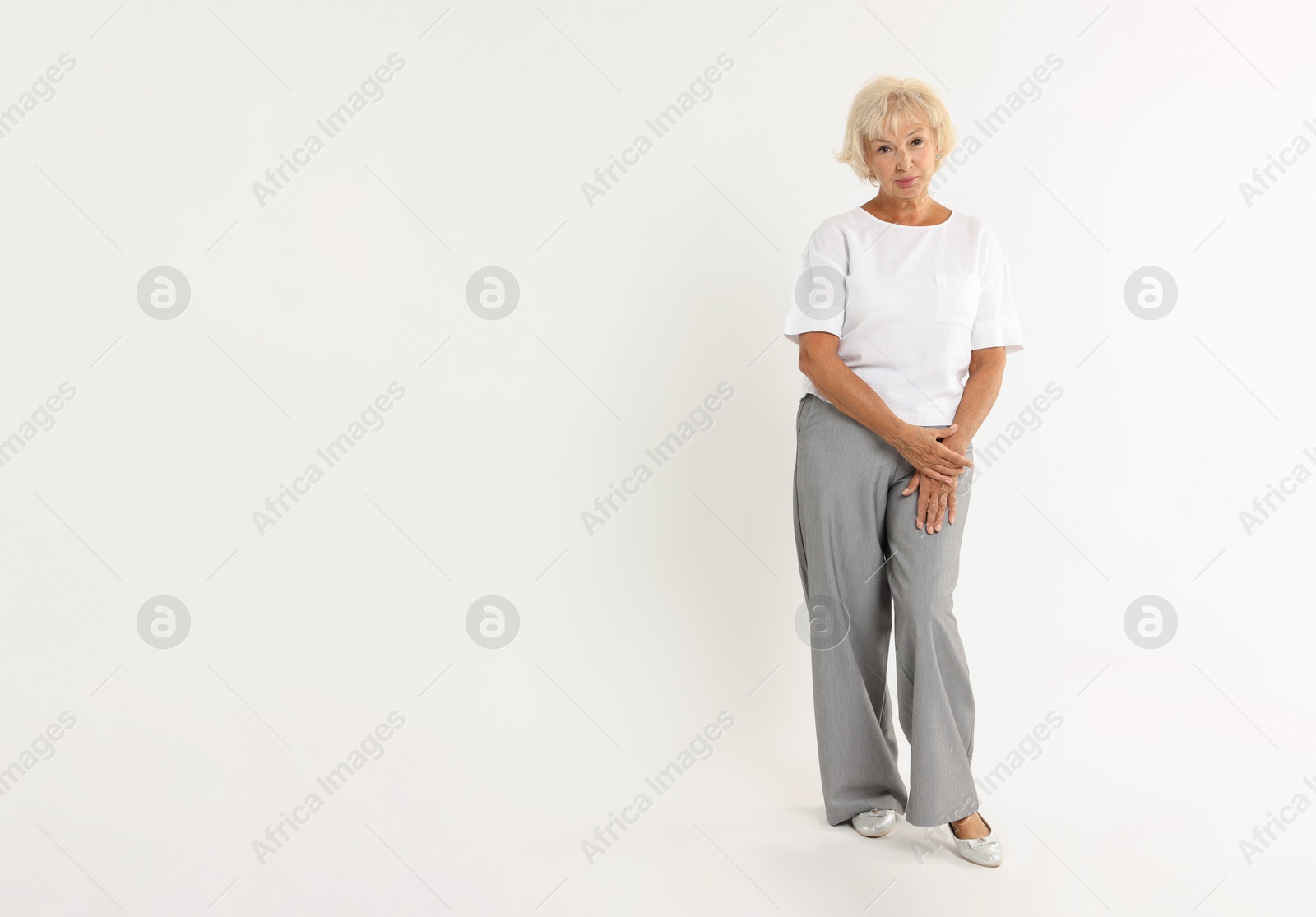 Photo of Full length portrait of beautiful senior woman on white background, space for text