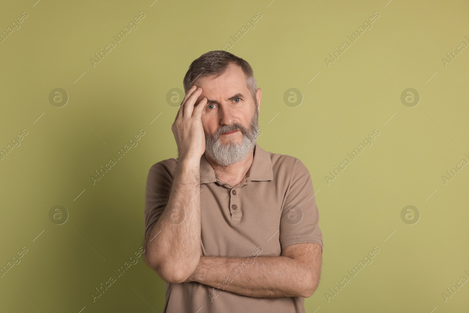 Photo of Portrait of senior man on green background