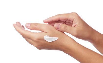 Photo of Woman applying cream onto hand on white background, closeup