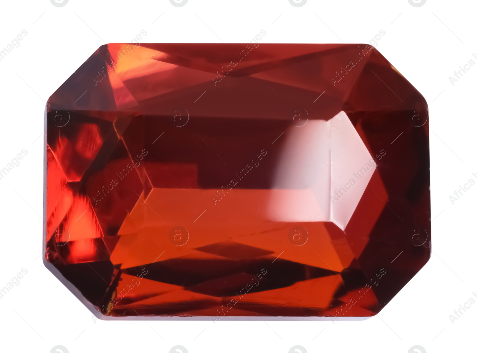 Photo of One red shiny gemstone isolated on white