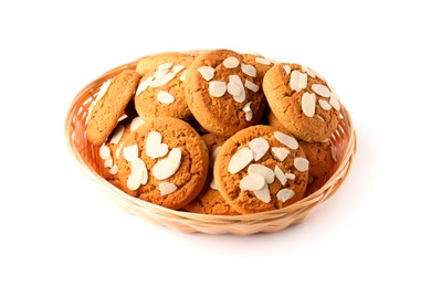 Photo of Tasty cookies with almond flakes in wicker basket isolated on white