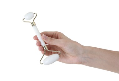 Woman holding face roller on white background, closeup