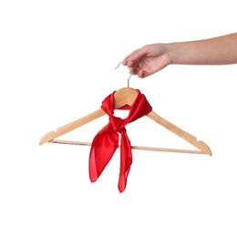 Photo of Woman holding hanger with red handkerchief on white background, closeup