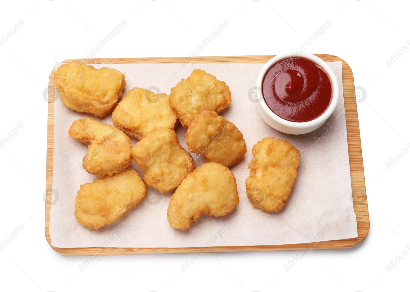 Photo of Delicious chicken nuggets with ketchup isolated on white, top view