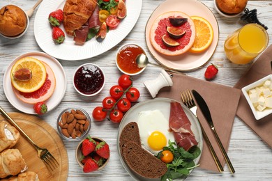 Photo of Different tasty food served for brunch on white wooden table, flat lay